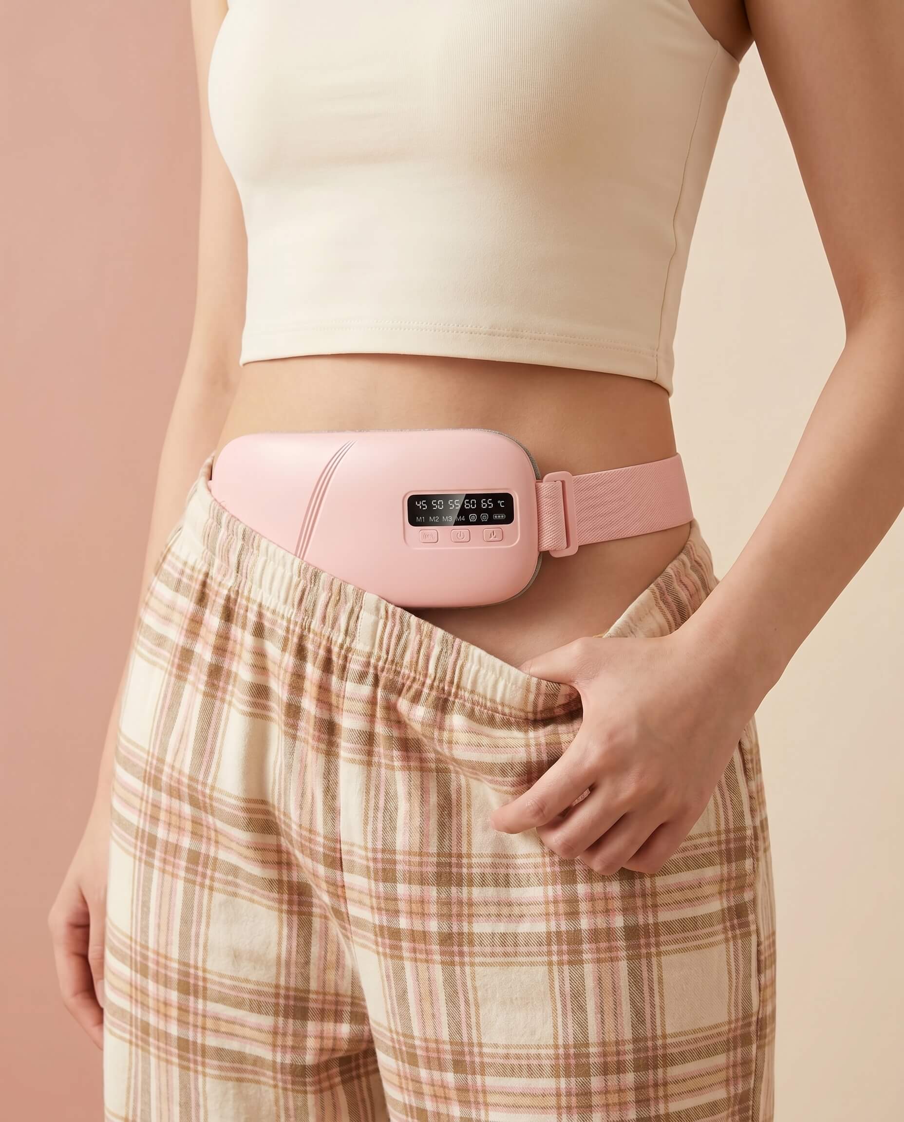 Person wearing a Avaleria heating pad waistband on a beige background